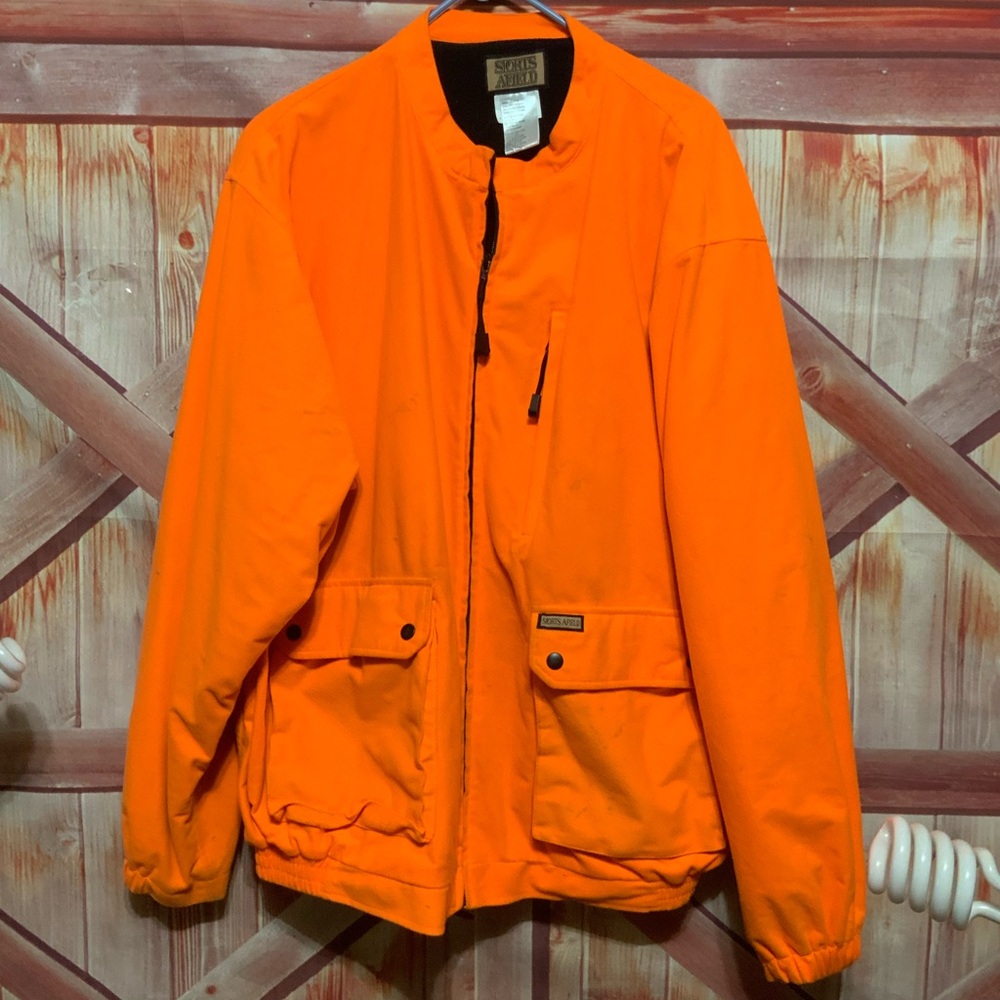 Sports afield. Hunter orange fall coat. Worn and warm